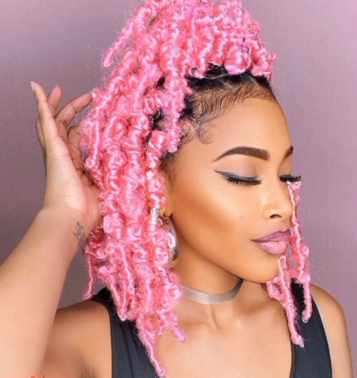 shoulder length bright pink butterfly locs with color